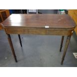 A Victorian mahogany fold over tea table.