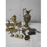 A mixed lot of brassware including dog nut cracker, rearing horse, dog, balance scales etc.