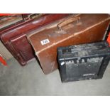 A small vintage suitcases a leather briefcase & an amplifier