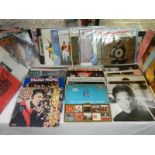 A mixed lot of LP records including Elvis Presley, Tom Jones, Village People, Hot Chocolate,
