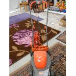 A Flymo electric mower with adjustable height etc.