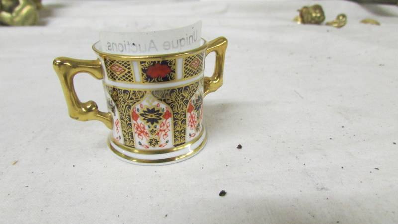 A miniature Royal Crown Derby loving cup in good condition. - Image 2 of 3