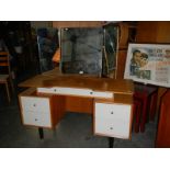 A dressing table with triple mirror, in good condition.