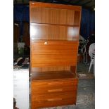 A retro style wall unit with 3 drawers, 2 shelves and drop down front.