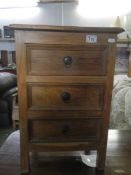 An oak 3 drawer chest.