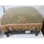 An Edwardian footstool in good condition, no damage to spindles.