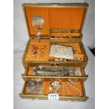A jewellery box and jewellery including silver chain.