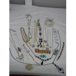 A good mixed lot of costume jewellery including a glass clock, 25 items.