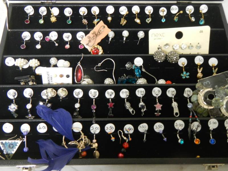 A cabinet of pairs and single earrings. - Image 2 of 5