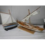 2 good model sailing boats, small 33 cm long, large 62 cm long.