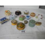 A mixed lot of interesting ceramic and wood trinket/pill boxes.
