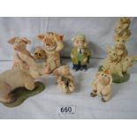 7 assorted pig figures.