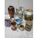 A good mixed lot of studio pottery including Italian jug, early drum etc.