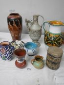 A good mixed lot of studio pottery including Italian jug, early drum etc.