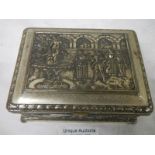 An embossed silver plated box decorated with Elizabethan dancers in a court yard, plate worn.