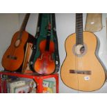 A Dulcet classical guitar, an 'El Primo' guitar, a practice amp and a Lark cased violin.