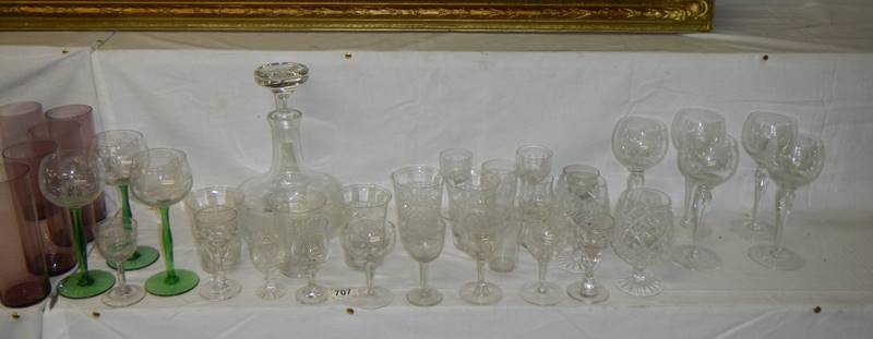 A modern decanter and various drinking glasses.