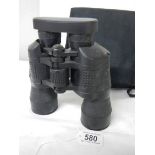 A cased pair of 7 x 50 binoculars with lens covers and fitted compass.