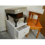 2 stools, a small side table and a white painted chest.