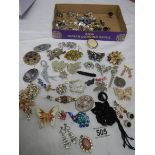 A mixed lot of jewellery including necklaces, brooches, earrings etc. (Approximately 40 items).