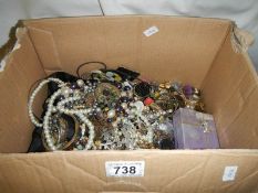 A large lot of unsorted costume jewellery.