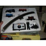 A Hornby OO gauge trains set including track mat, rail track, power unit and locomotive.