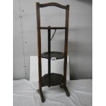 An oak 20th century folding cake stand, in good condition.