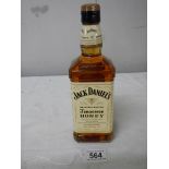 A bottle of Jack Daniels Tennessee Honey Whiskey.