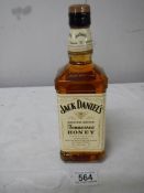 A bottle of Jack Daniels Tennessee Honey Whiskey.