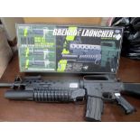 A Tokyo Marui M16 A1-M203 grenade launcher, magazine holder,