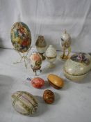 A mixed lot of decorative collector's eggs in china and other materials.