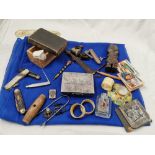 Box of collectibles – pocketknives, cigarette holders, early new testament dated 1785, napkin rings,