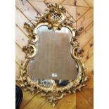 19thC Carved Giltwood Mirror, in the Rococo taste, the pierced asymmetrical frame with scroll