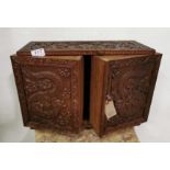 Carved Mid 20th C Chinese Table Stationery Cabinet, decorated with raised figures of dragons and