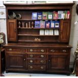 Early 19th C Oak Welsh Dresser (what later back), over a base of 6 drawers, 2 cabinet doors,