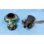 Brass middle eastern powder flask with rope and a middle eastern tobacco jar, inset with polished