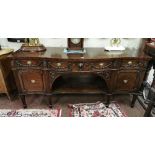 Large 19thC Mahogany Sideboard - serpentine shaped – with three apron drawers – decorated with