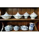 2 shelves – 2 pairs of blue and white tureens and other tureens, jug etc