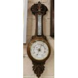 Carved Oak Framed Aneroid Barometer, stamped “T Bassinet, Liverpool”