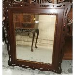 A Wall Mirror with pierced and inlaid mahogany frame, bevelled glass, 101cm x 85cm