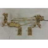 7 Piece Polished Brass Fire Set including a pair of Fire Dogs, pair of fire rests and a 3-piece