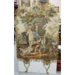 Brass framed floor standing machine woven tapestry of figures on horseback mounted with gilt metal