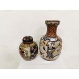2 Japanese Vases – 1 bulbous shaped with figures in a garden & 1 blue ground floral with a lid (2)
