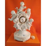 Porcelain Cased Mantel Clock, featuring 5 applied heavenly cherubs (some damage to cherubs), with