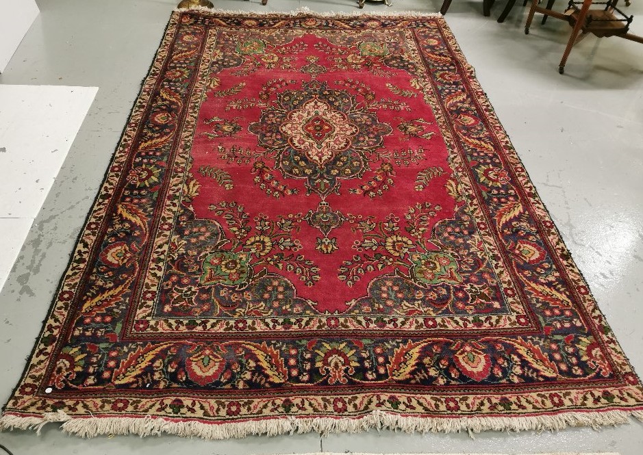 Persian Wool Floor Rug, with a central red ground medallion, blue floral multiple borders, 2m x 2.
