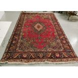 Persian Wool Floor Rug, with a central red ground medallion, blue floral multiple borders, 2m x 2.