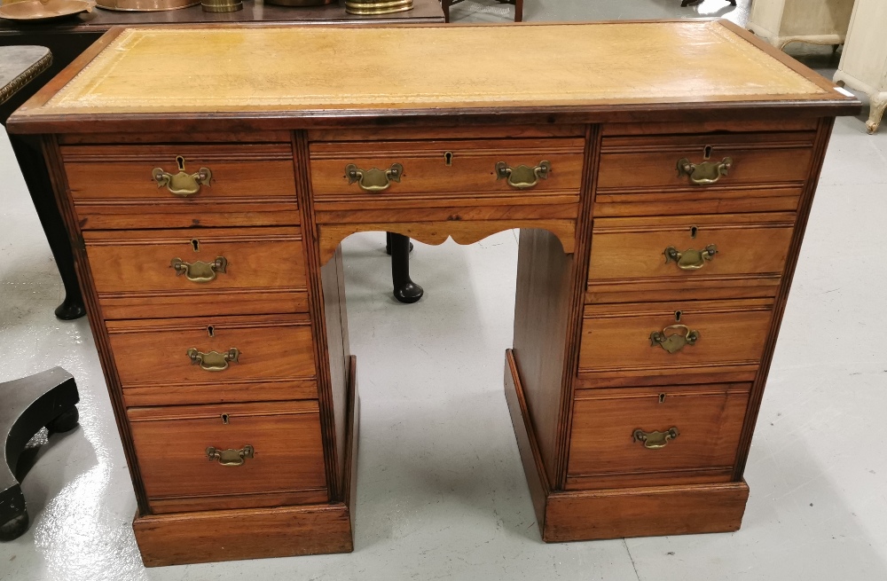 A small Victorian walnut knee-hole Desk with tooled brown leather top, brass drop handles, 106cm w x