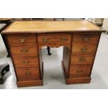 A small Victorian walnut knee-hole Desk with tooled brown leather top, brass drop handles, 106cm w x