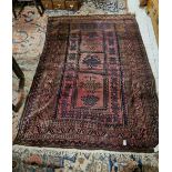 Persian wool Floor Rug, red ground with blue patterns, 1.88m x 1.3m and a large old wool floor