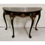 A George III style mahogany demi-lune Side Table with carved & parcel gilded decoration, Queen